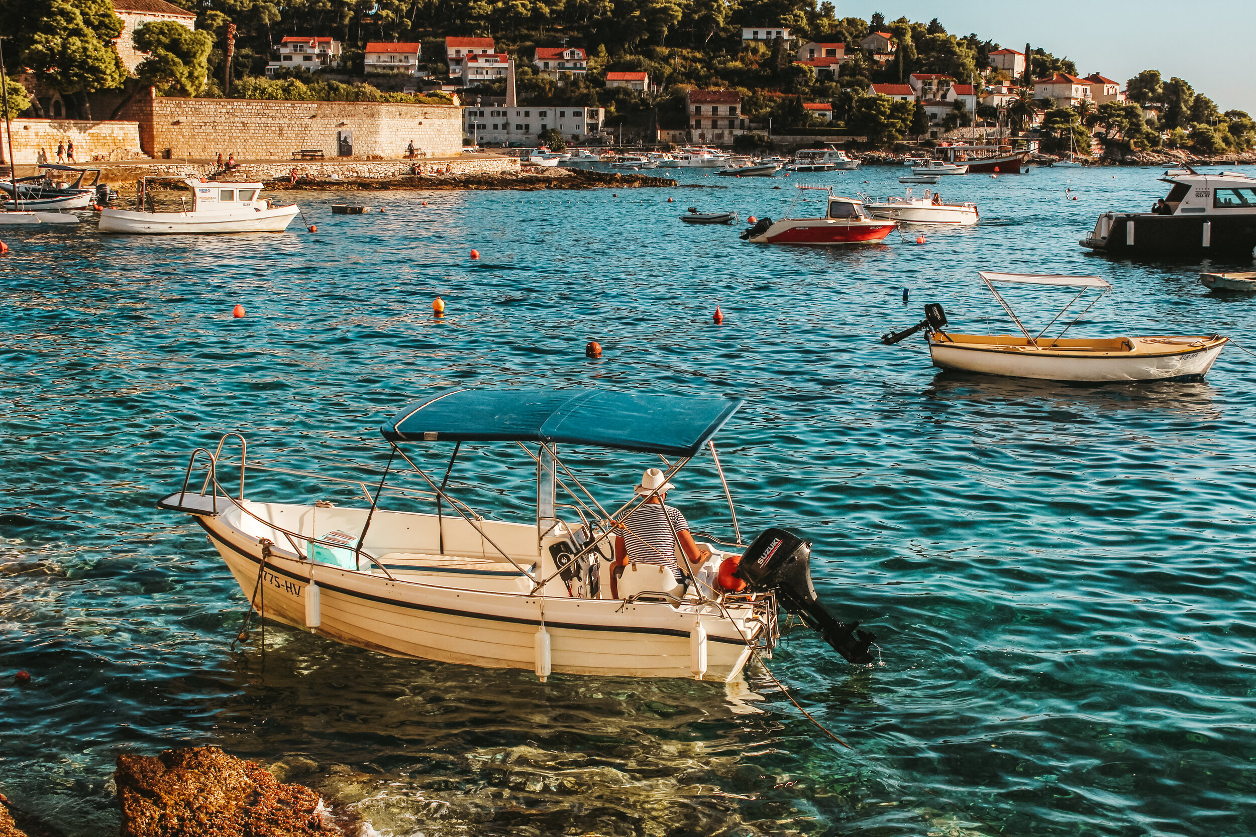 Small boat near coastal caves